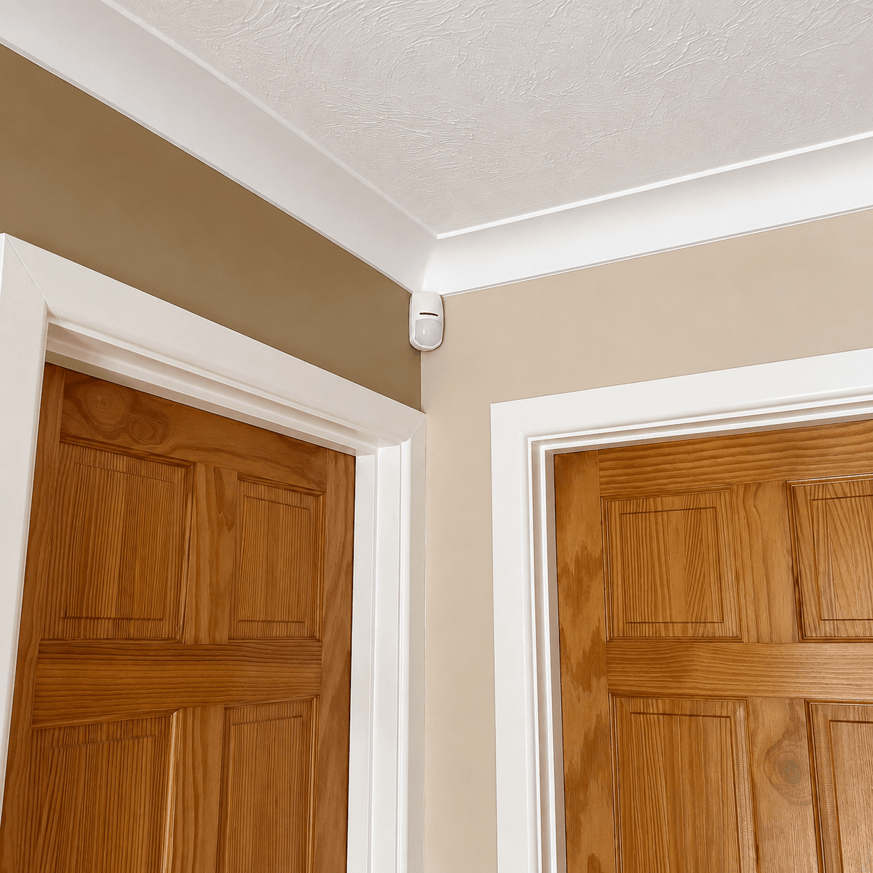 Indoor PIR motion sensor installed as part of an intruder alarm system