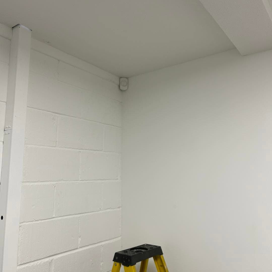 Intruder alarm detector installed in a commercial interior