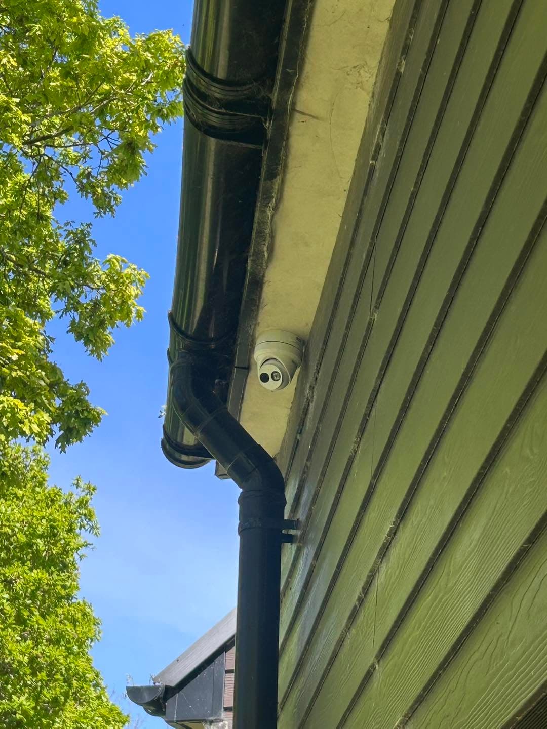 Hikvision CCTV camera installed beneath the roofline of the Bluebird Security office