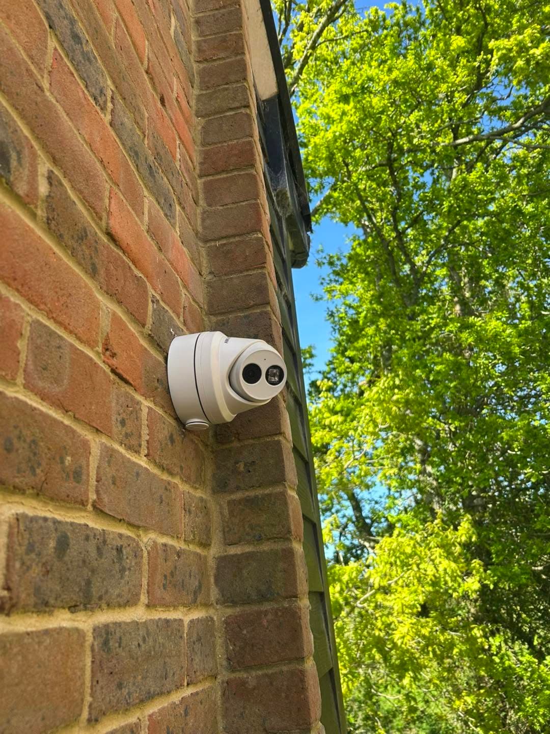Hikvision CCTV camera installed on the exterior brickwork of the Bluebird Security office