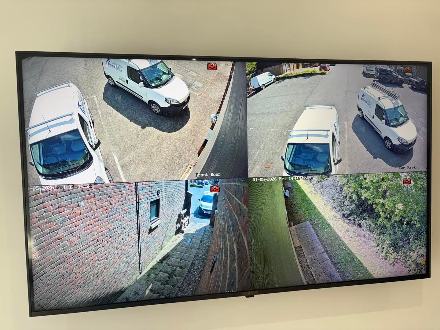 Hikvision AcuSense CCTV monitor showing views around the Bluebird Security office