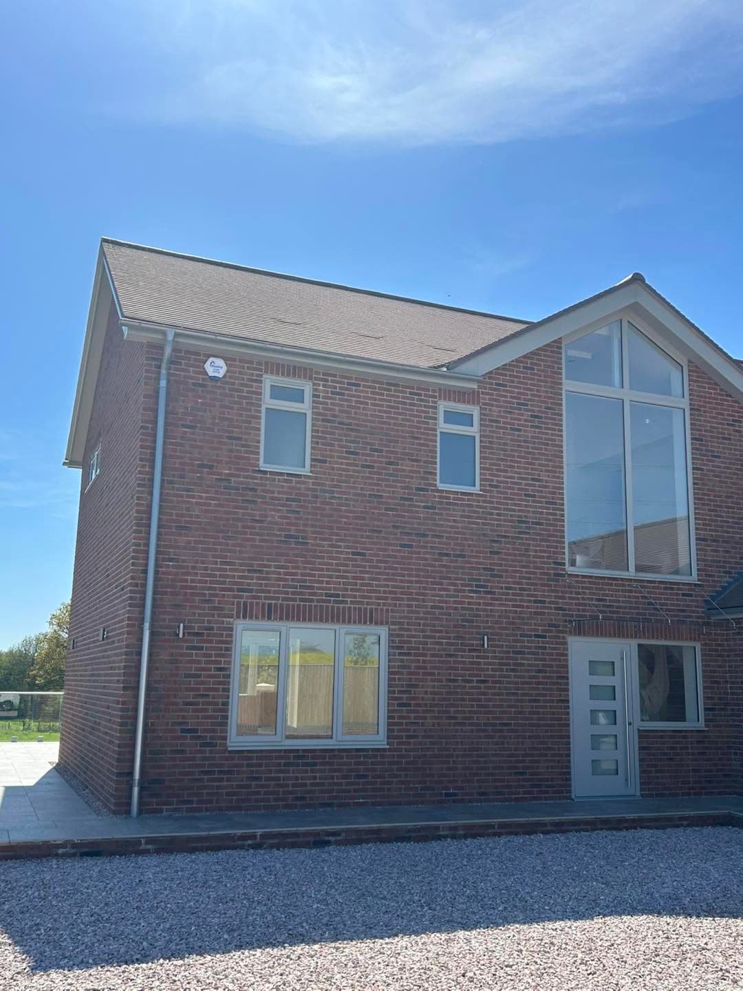 Residential property with a Bluebird Security external alarm bell box