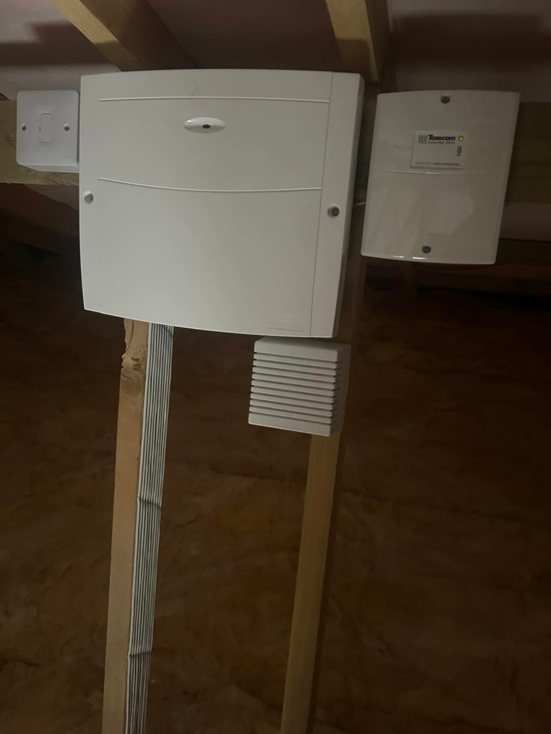 Texecom Premier Elite alarm control equipment installed in a loft space